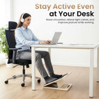 Woman using the slant board as a footrest under her desk