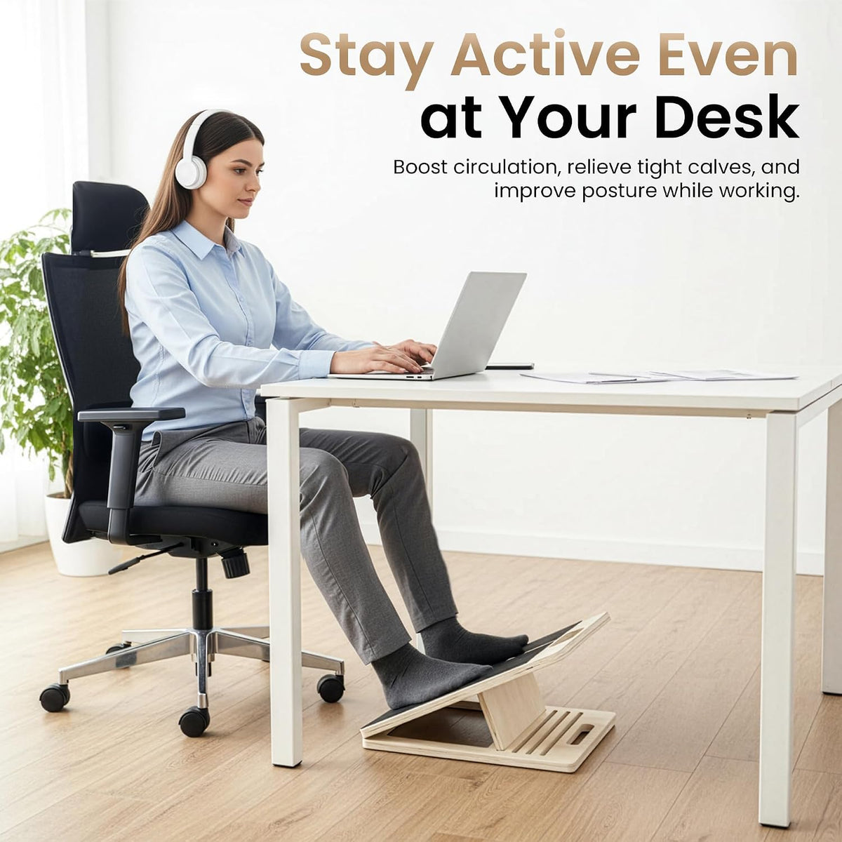 Woman using the slant board as a footrest under her desk