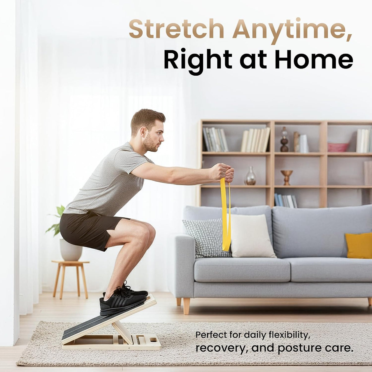 Man doing a heel-elevated squat on the wooden slant board at home